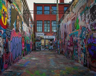 This image has an empty alt attribute; its file name is a-alley-sm.jpg